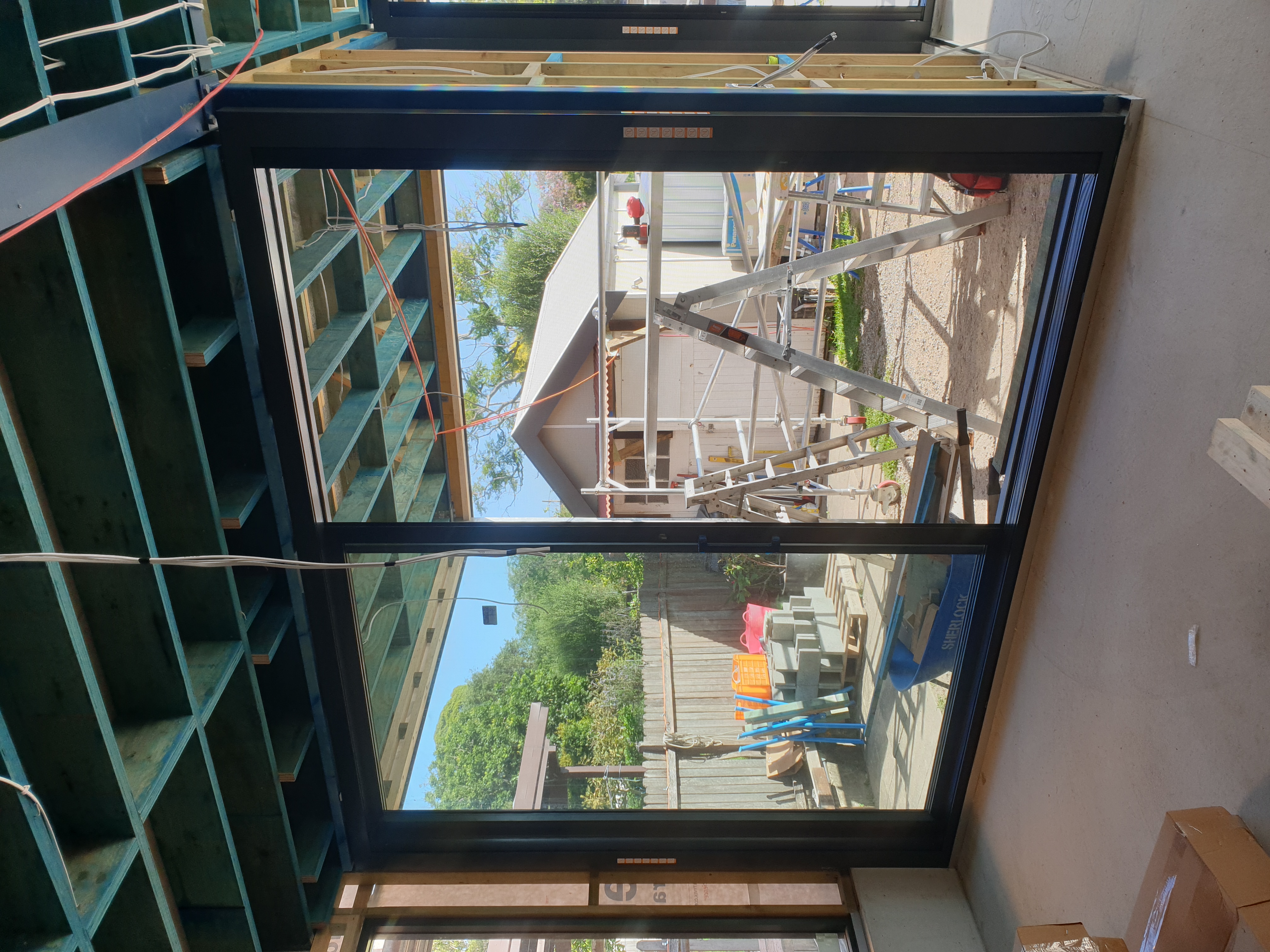 Large motorised zip slide screen enclosing a luxury patio area